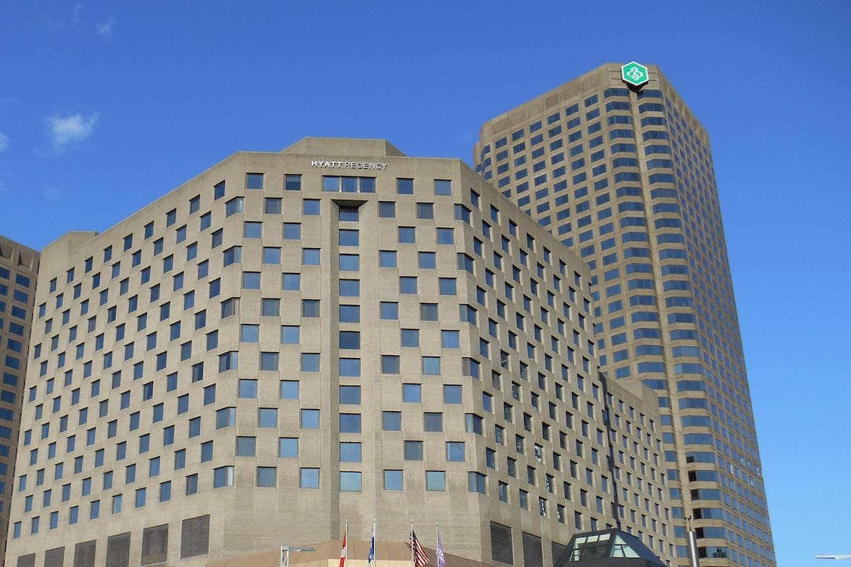 a group of buildings with persony windows