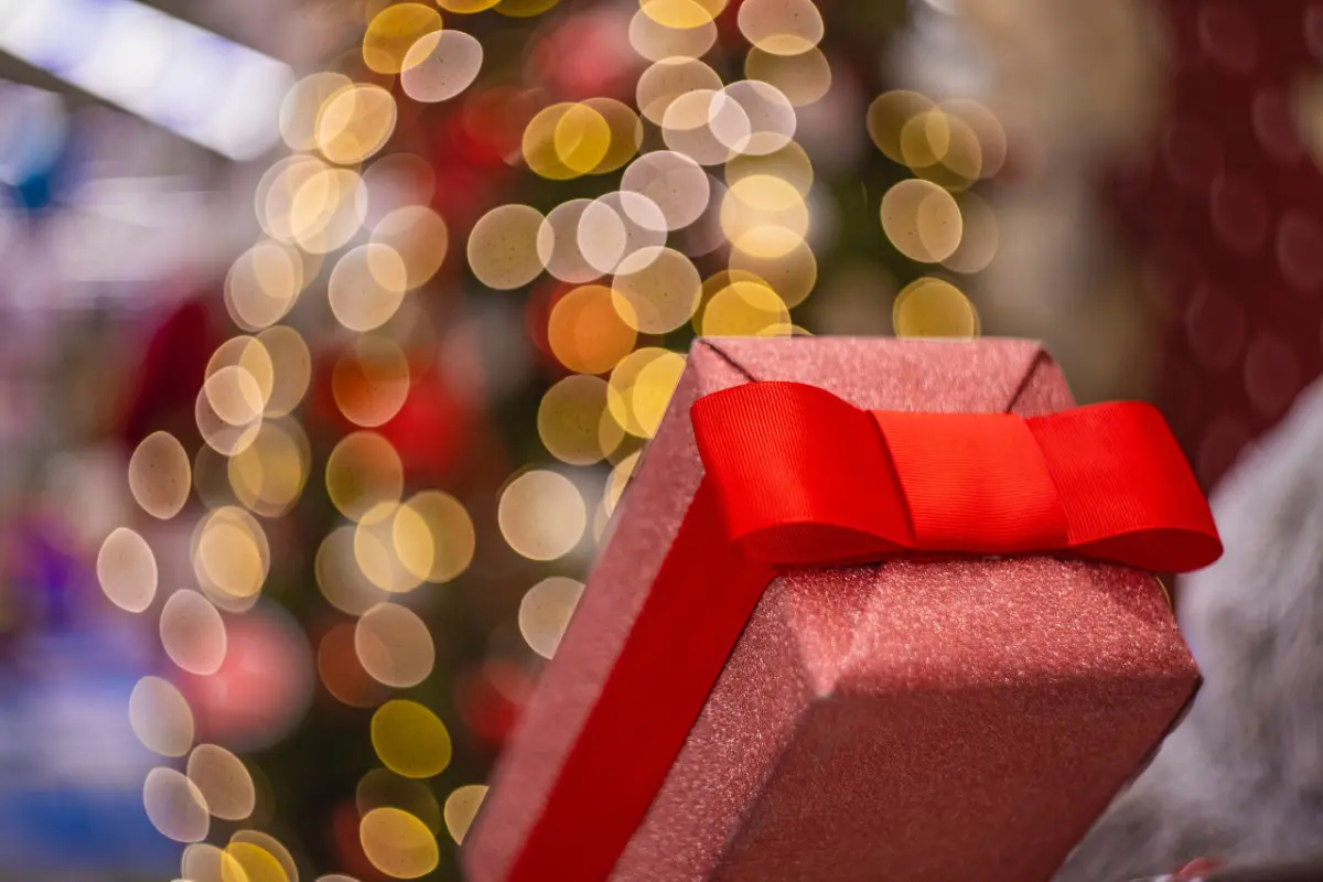 a red gift box with a red bow