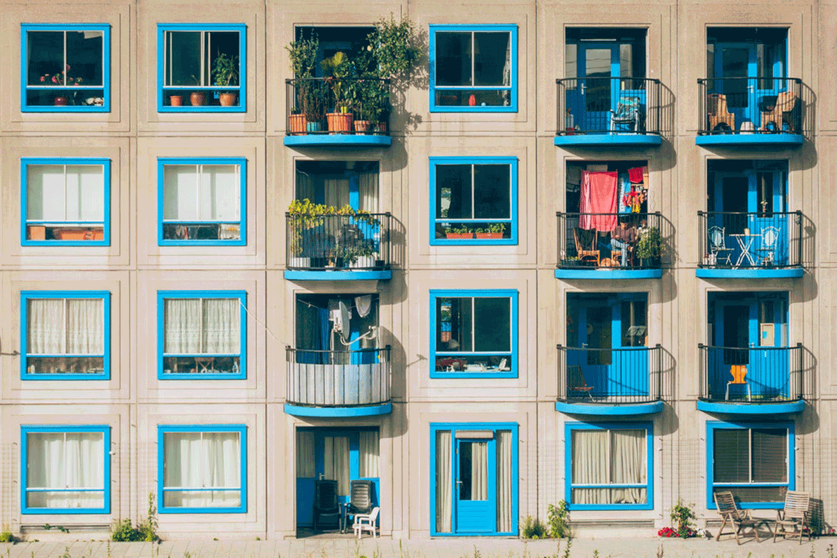 a building with blue trim and balconies