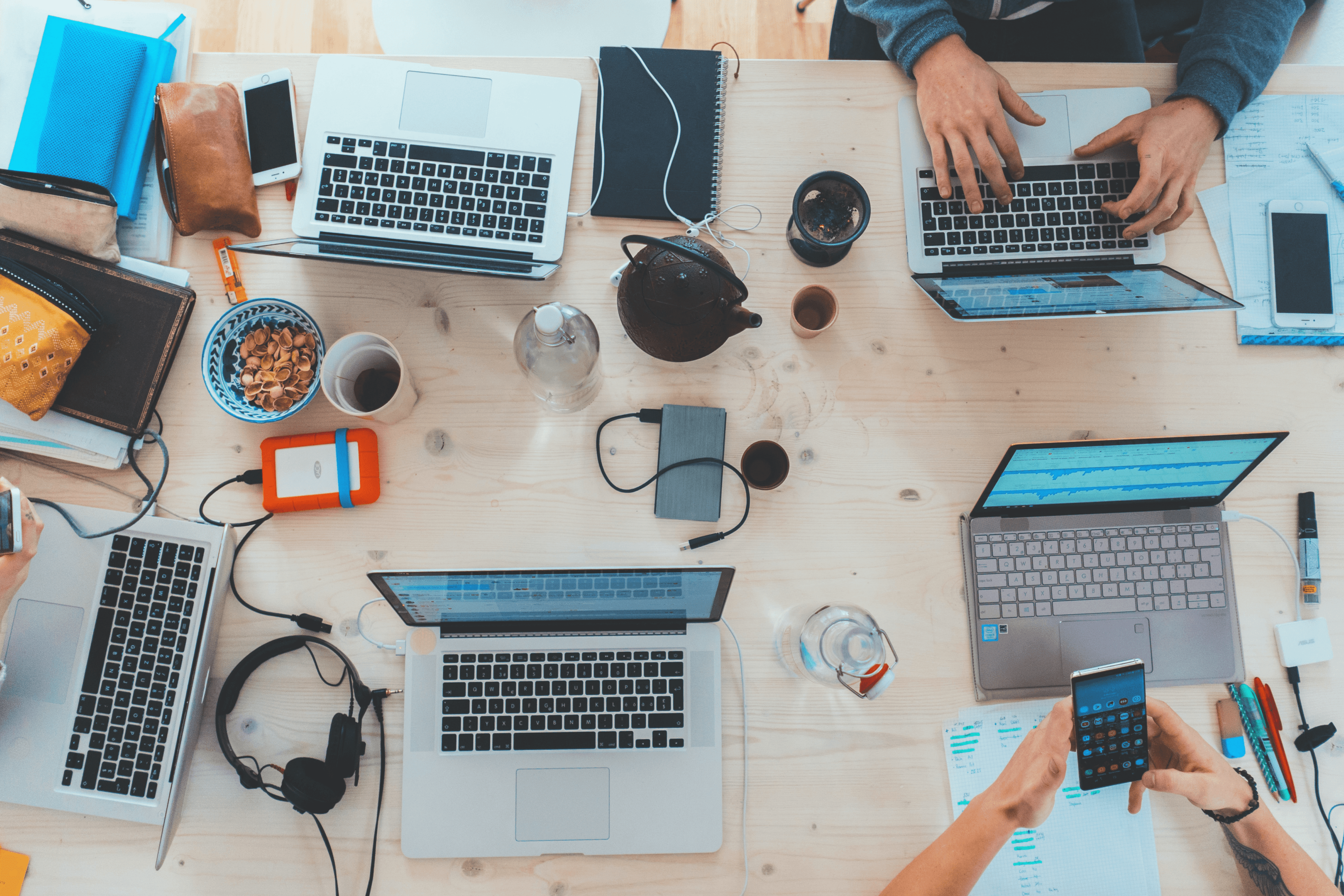 Team working on laptops at a desk