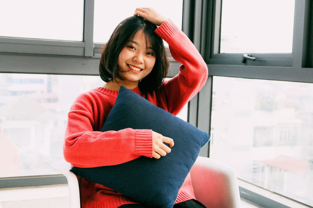 a person holding a pillow