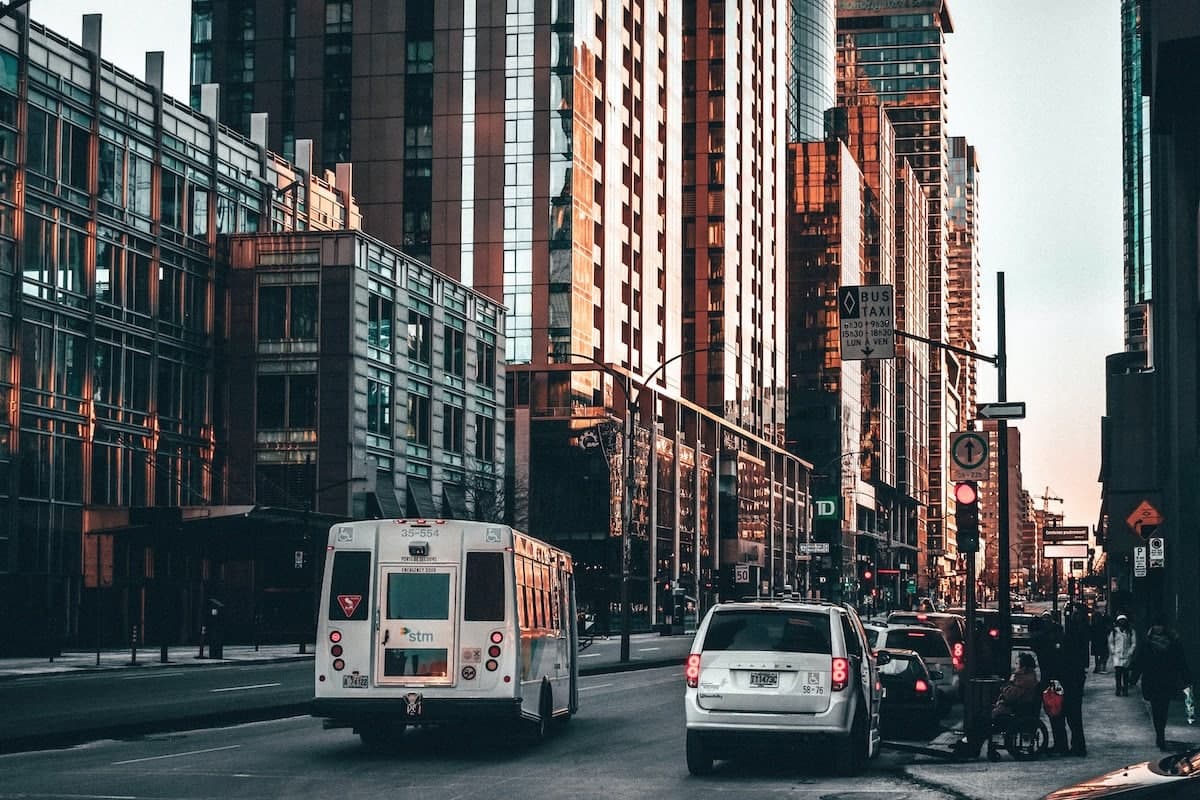 a city street with cars and a bus