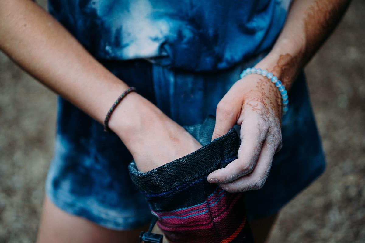 Women reaching for money in her purse.