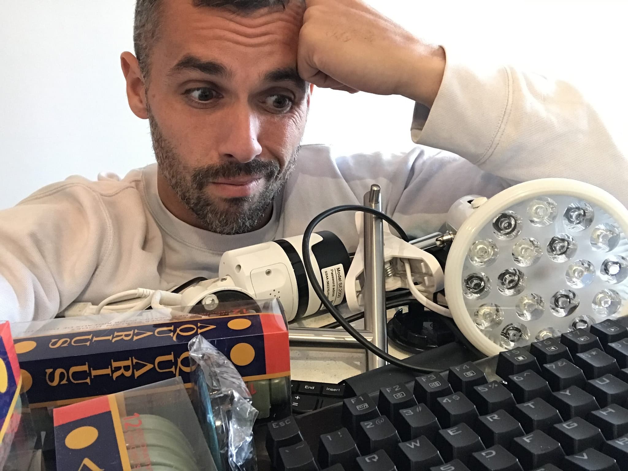 An individual working on a computer with a mouse and keyboard.