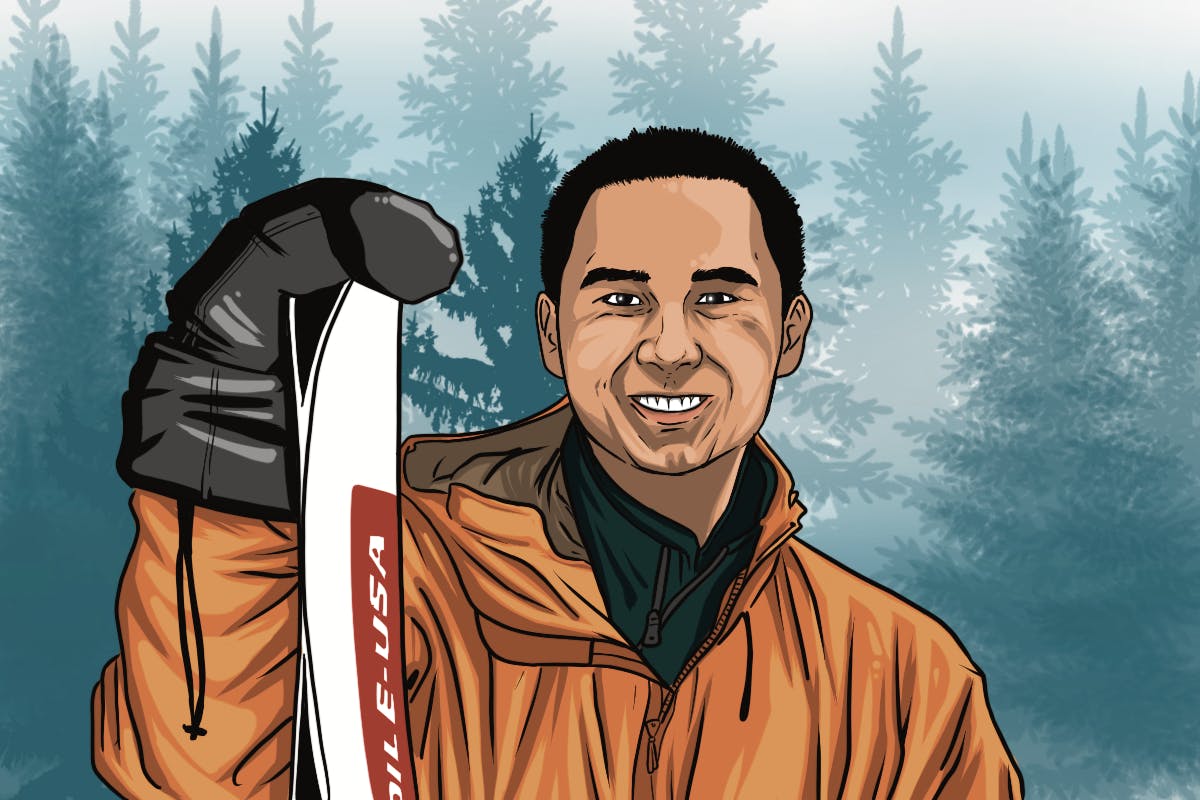 Winter sports enthusiast holding skis, surrounded by trees in a forest.