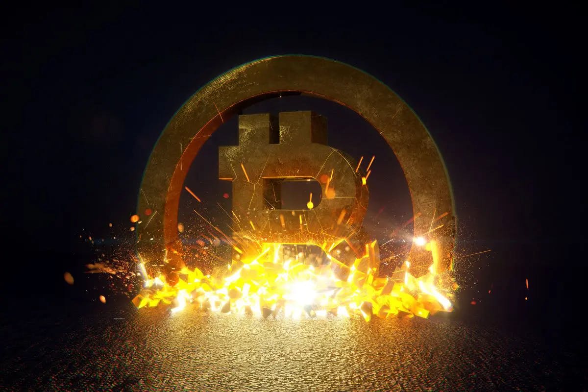 a gold sign with flames bitcoin symbol coming out of it