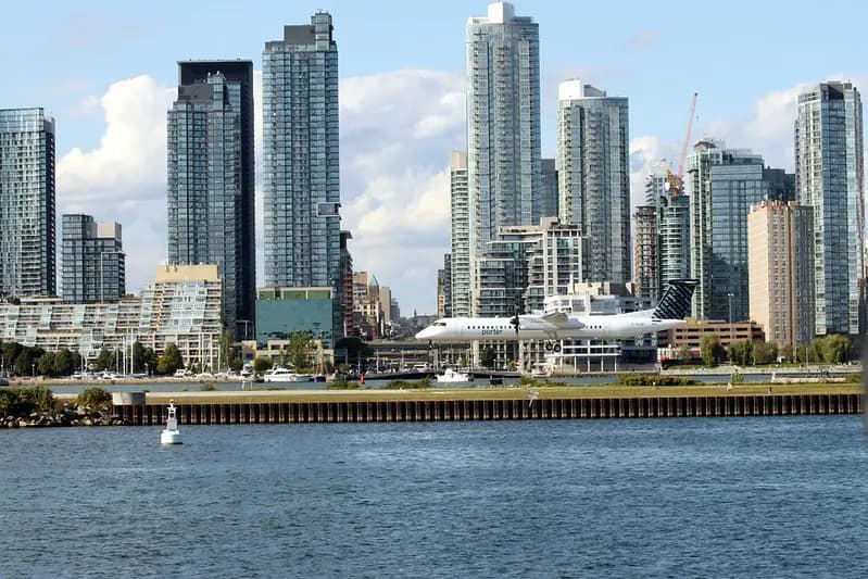 Urban landscape with tall buildings and boats