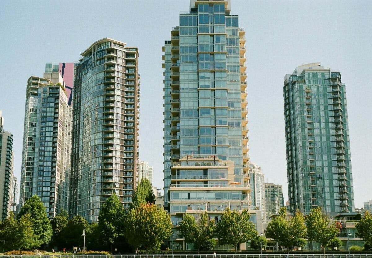 a group of tall buildings with trees