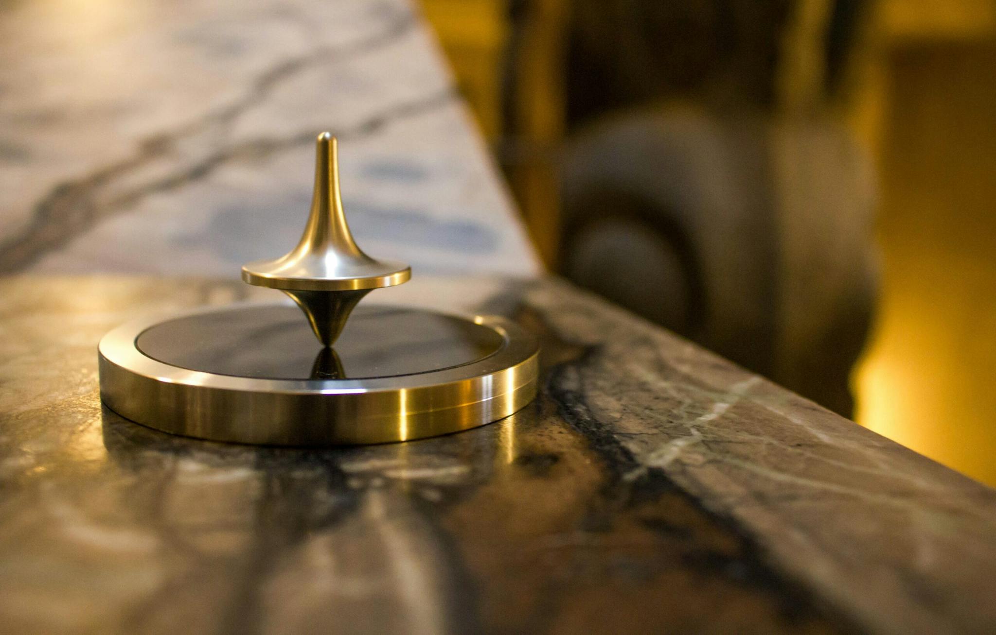 Gleaming gold piece displayed on polished marble table