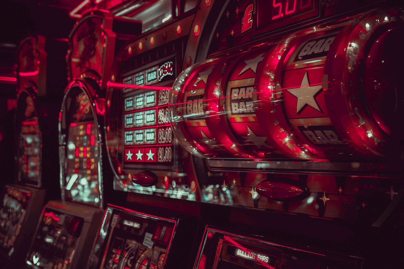 A casino machine adorned with vibrant red lights, exuding an enticing allure and captivating ambiance.