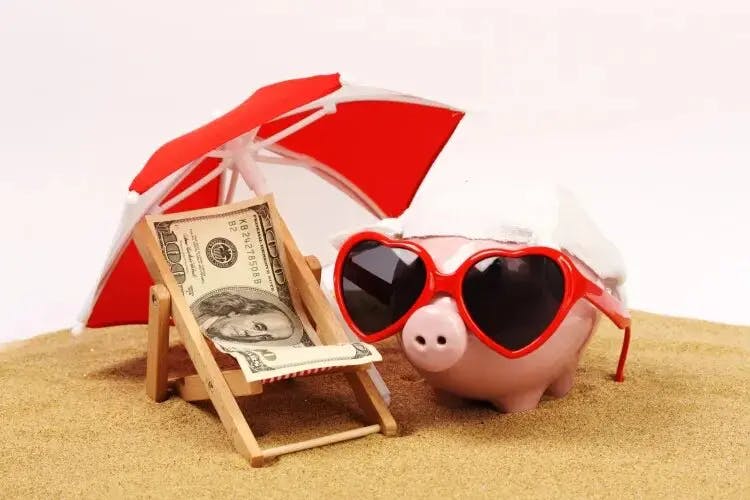 Cute piggy bank enjoying beach day with shades and umbrella