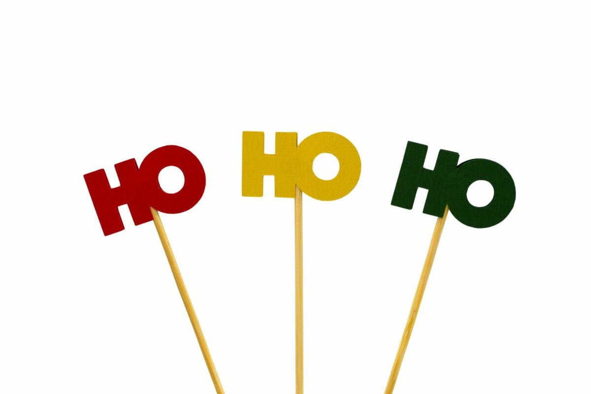 Festive Christmas party decorations with 'ho ho ho' theme.