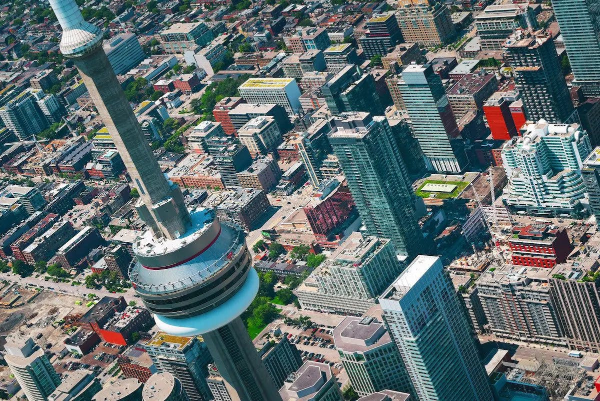 An aerial view showcasing the vibrant city of Toronto, capturing its urban landscape and architectural marvels.
