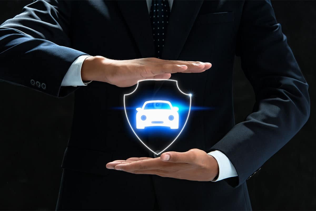 a person in a suit holding a shield with a car icon