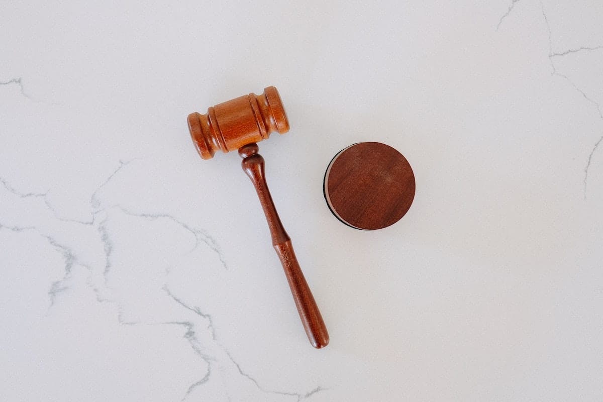 a wooden gavel and a round object