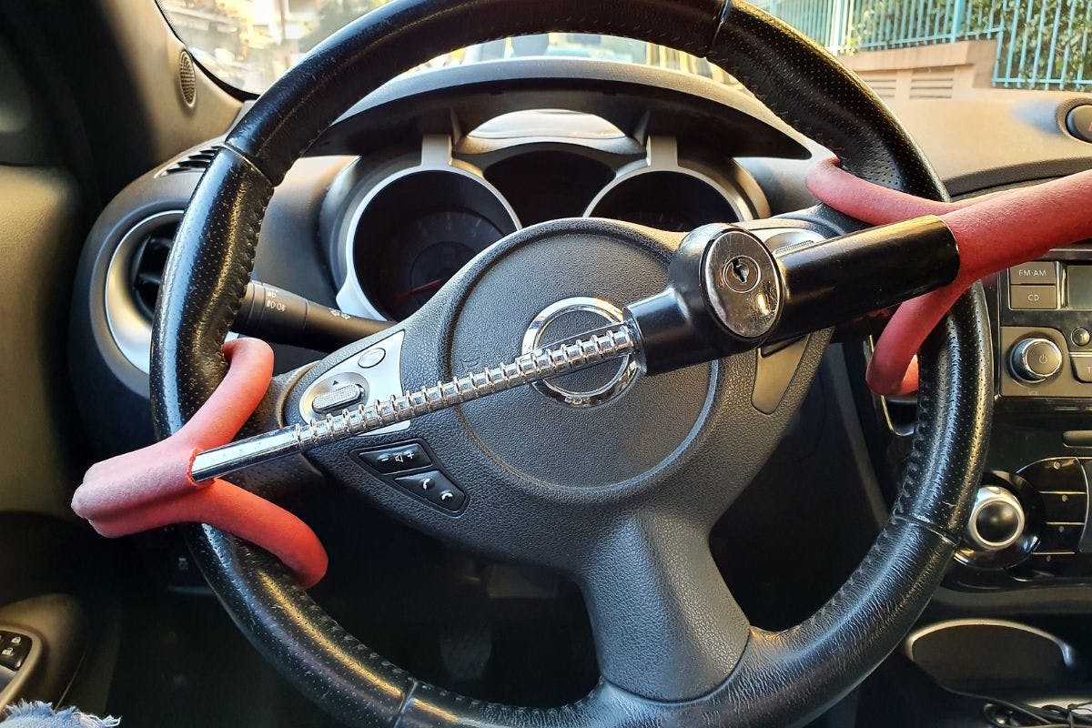 A steering wheel with a wrench and a car seat, symbolizing automotive maintenance and comfort.