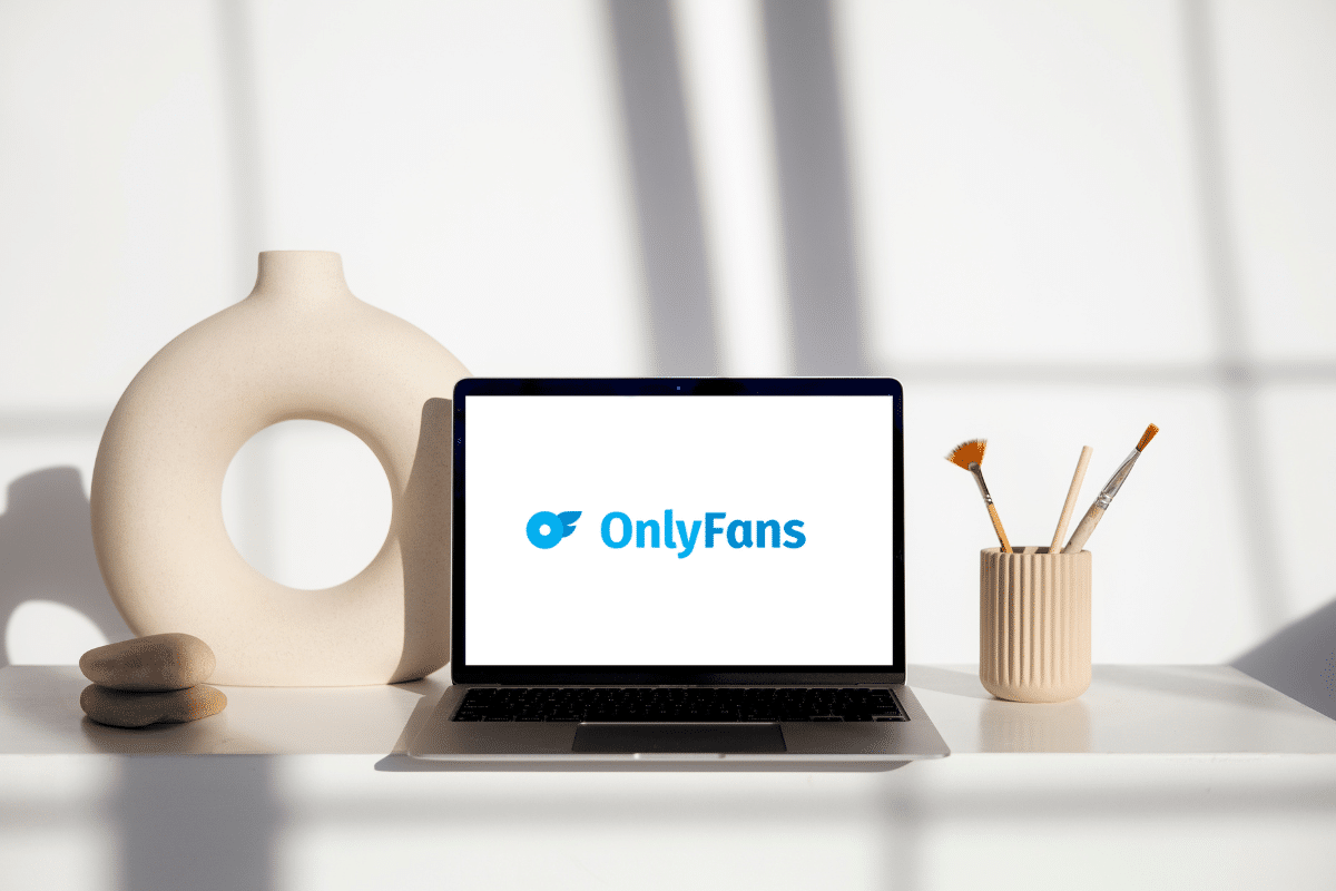 A laptop displaying the distinctive logo of OnlyFans, a popular online platform, known for its diverse content and subscription-based model