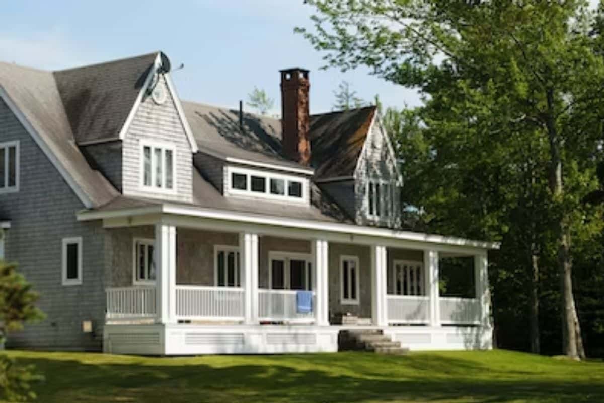 a house with a porch and a lawn