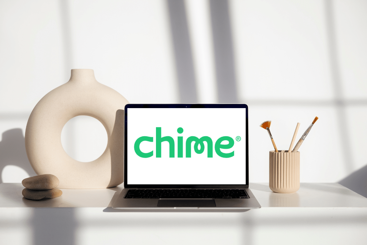 Chime mobile banking logo on the laptop screen on a desk
