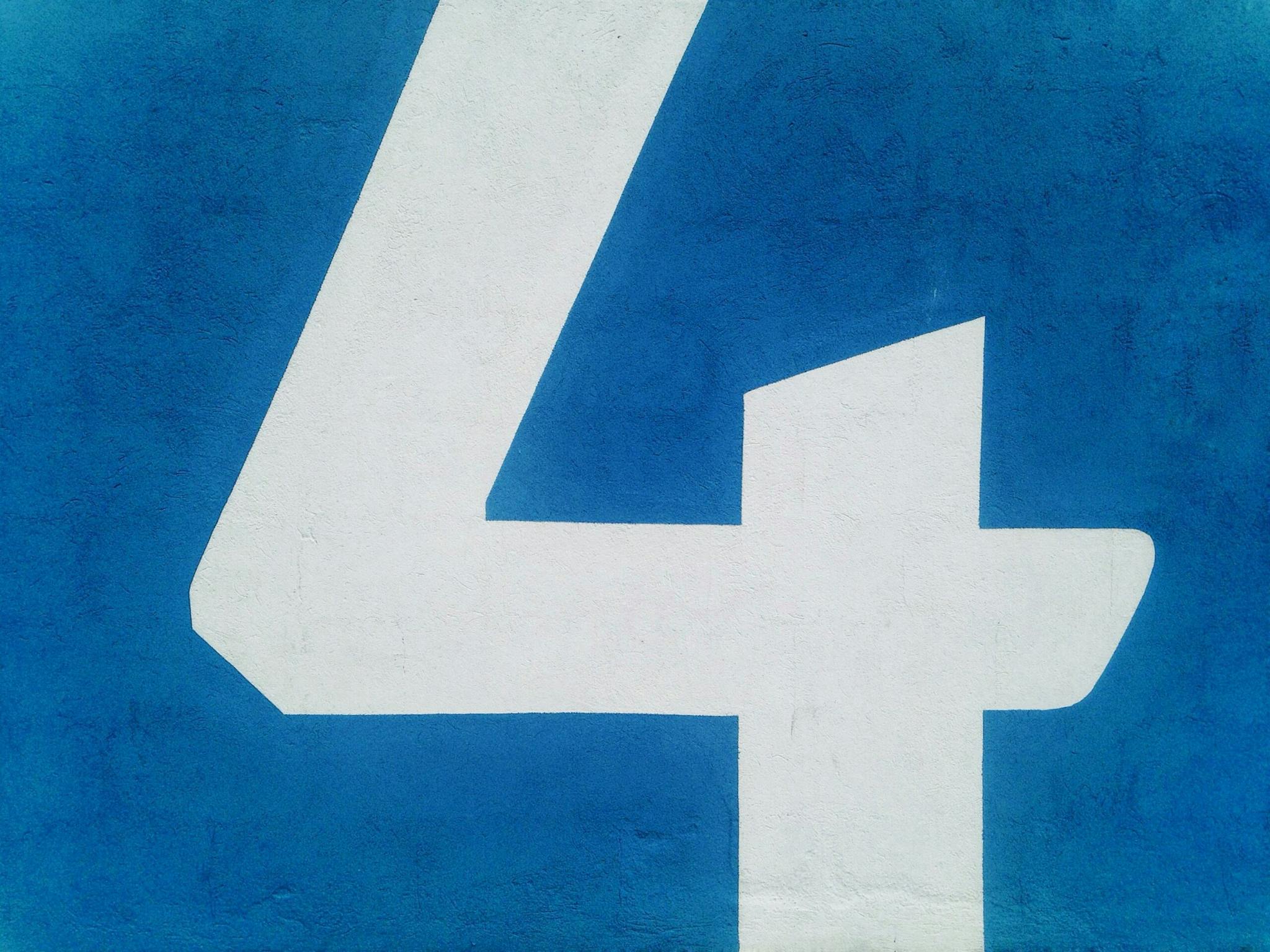A blue and white number four, representing a numerical digit