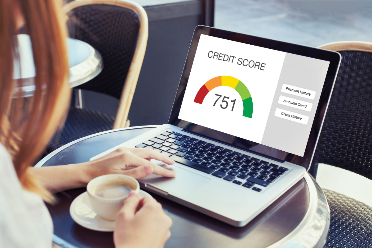An image showing a credit score and a calculator, essential tools for evaluating one's creditworthiness.