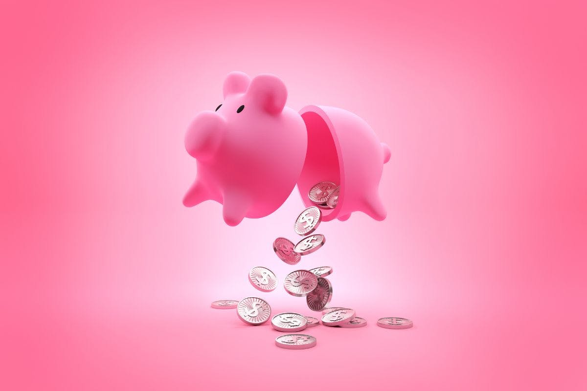 a piggy bank with coins falling out