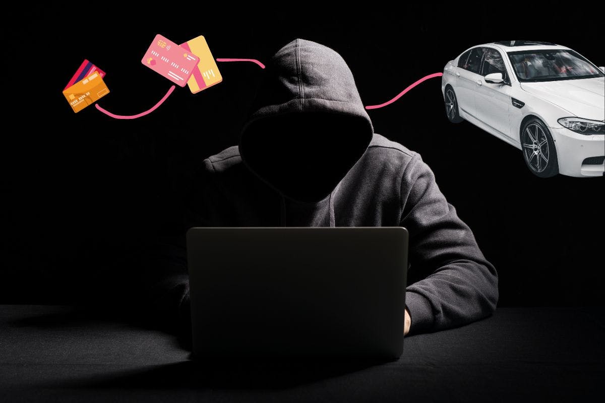 Person wearing black hoodie, we cannot see their face, on a black laptop. Behind there is a car and credit cards illustrating a particular case of identity theft in Canada.